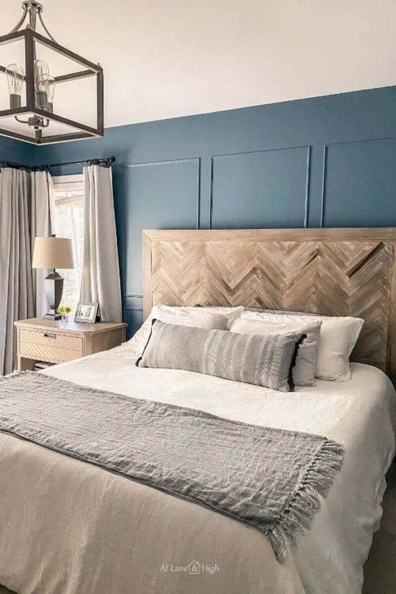 herringbone DIY headboard idea against a blue wall