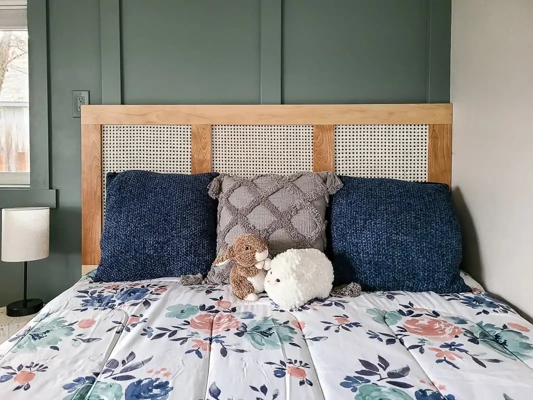 cane headboard with blue flowered bedding