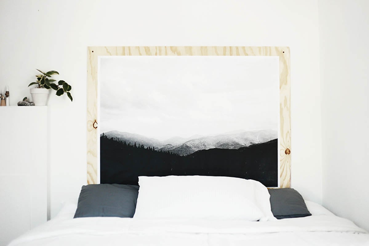 DIY headboard using plywood and a mountain scene print in black and white