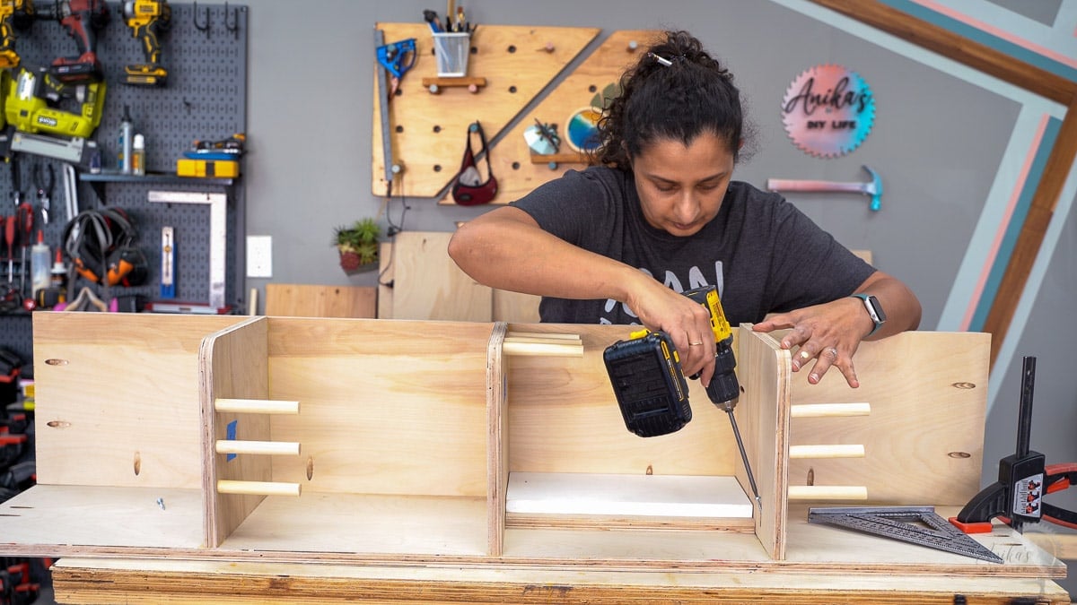 Woman attaching shelves using pocket hole screws