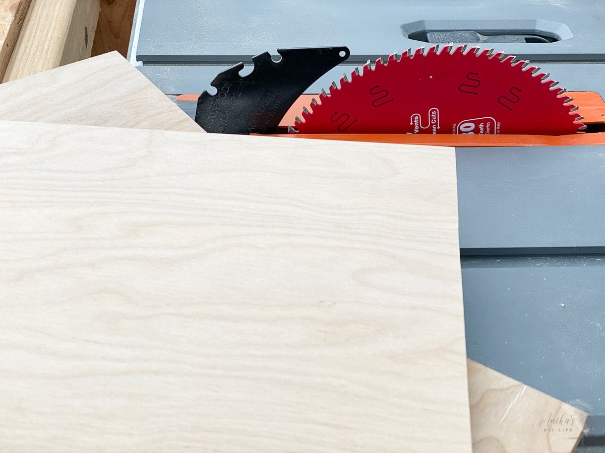 Table saw with 80-tooth blade and cut up plywood next to it