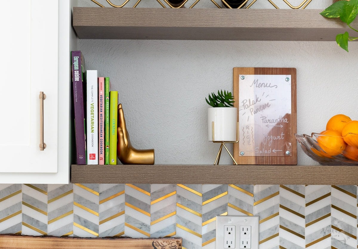 Dry erase meal planning board on kitchen shelf