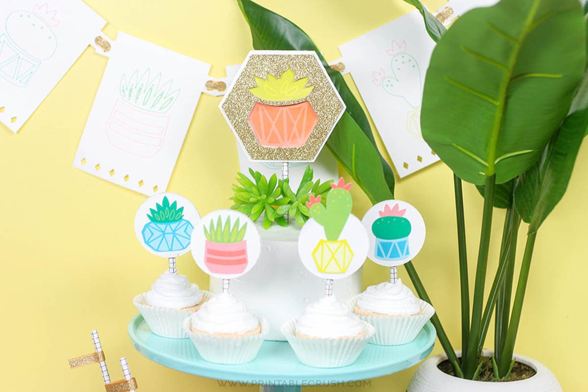 Cake with cake toppers made from chipboard with a Cricut Maker