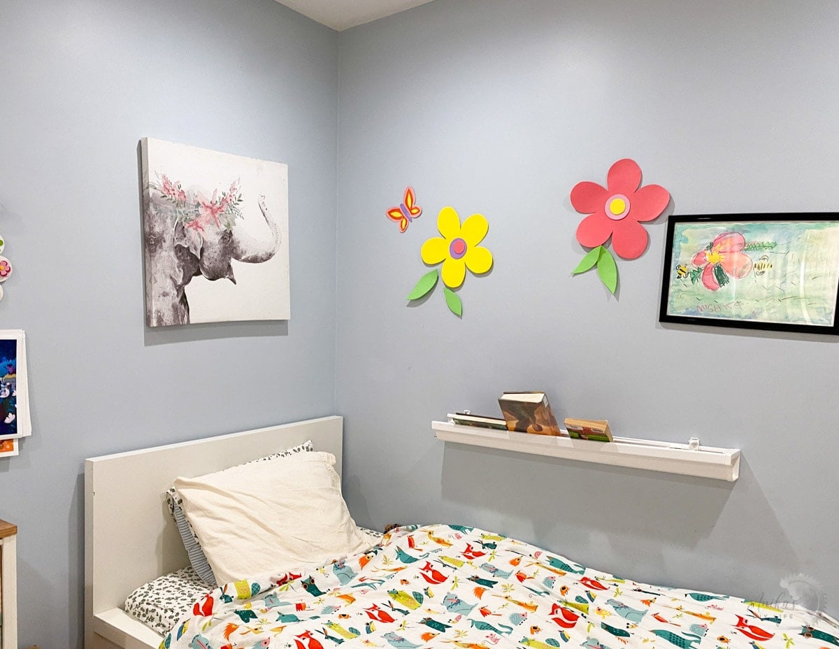 Room with blue walls and child's bed