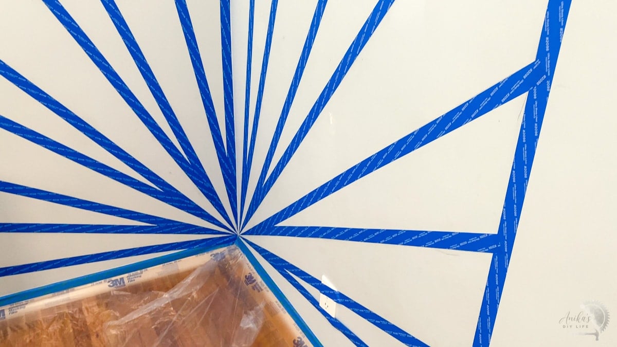 Sunburst pattern taped off on wall