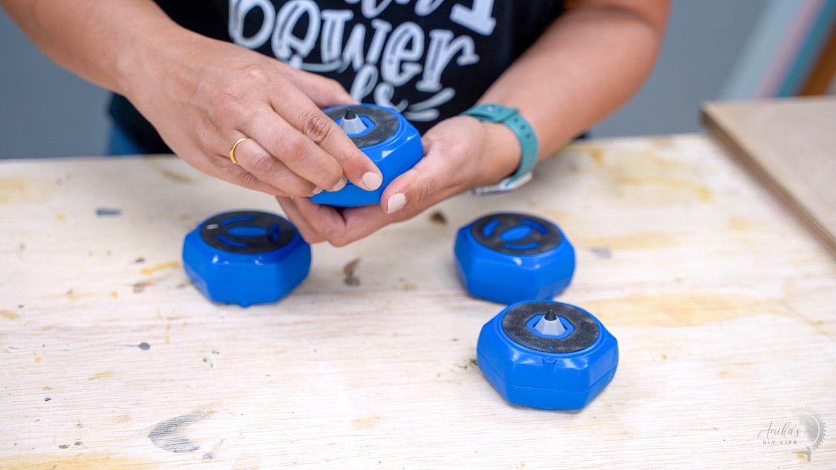 woman twisting the multipurpose project blocks to reveal the painter's tip
