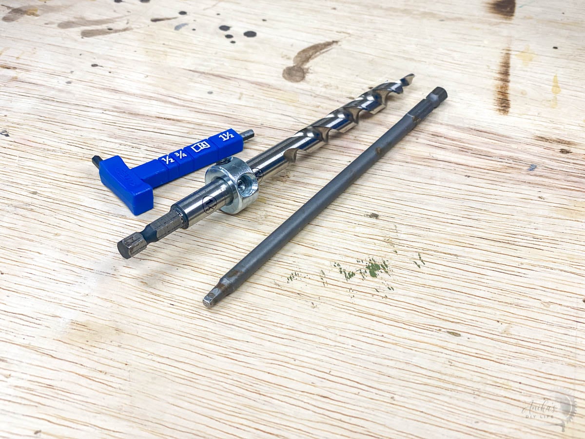 Pocket hole drill bit, driver and thickness gauge on workbench