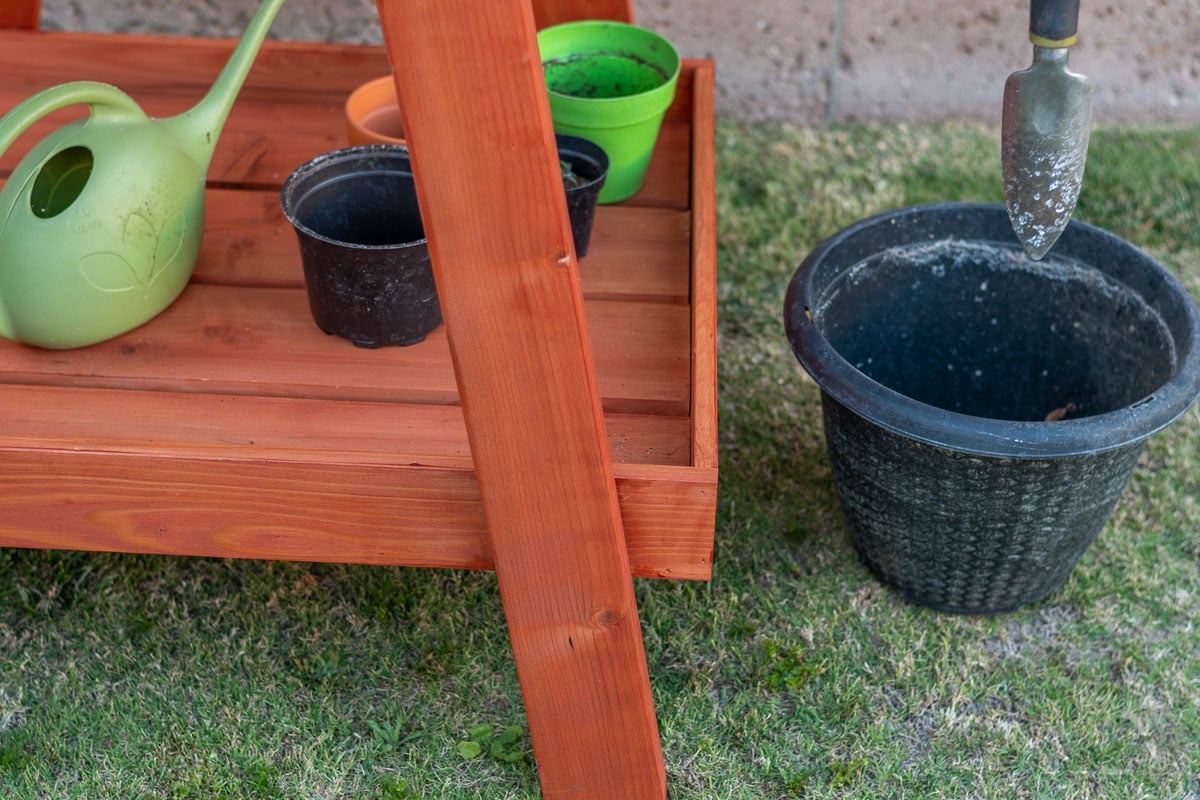 Close up of the redwood potting bench bottom shelf
