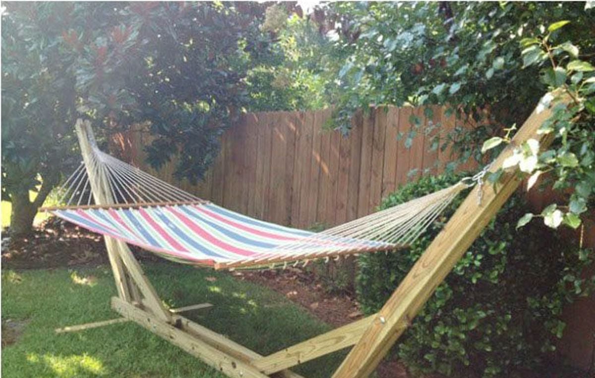 Wooden hammock stand in garden