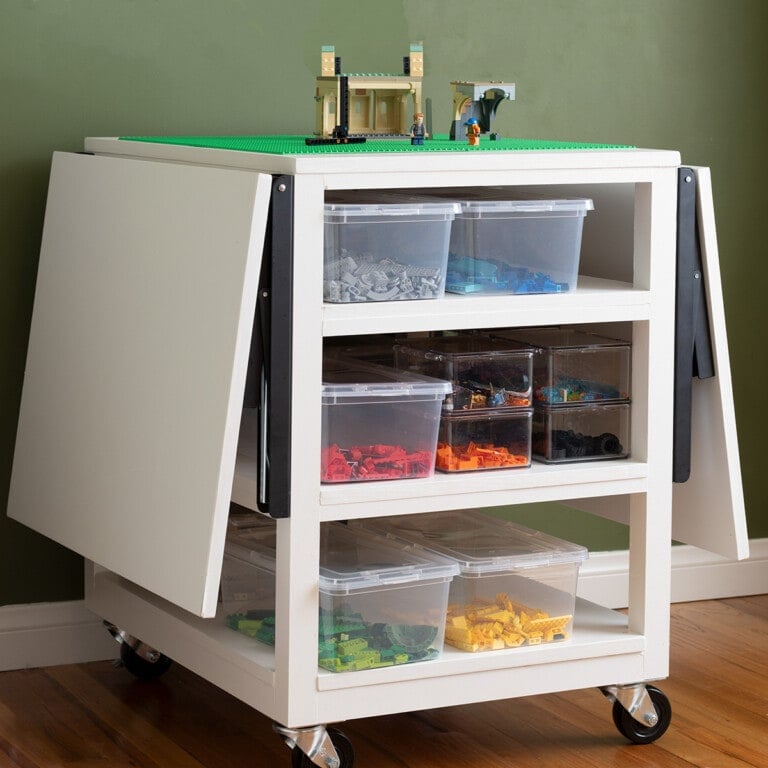 Learn how to make a DIY Lego Table with Storage and folding sides with the detailed tutorial and plans. This table is perfect for small spaces.