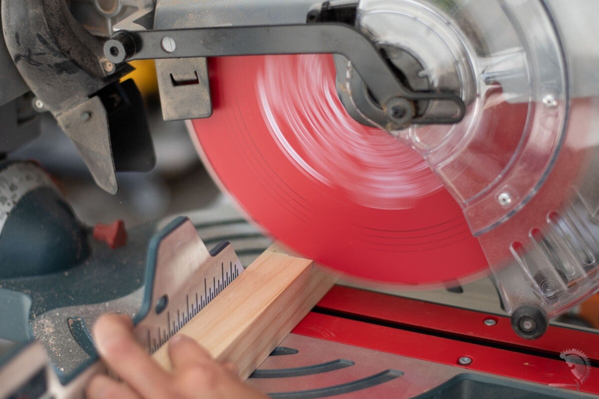cutting a 2x2 on a miter saw.