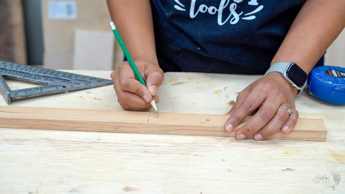 marking a board to cut on a miter box.