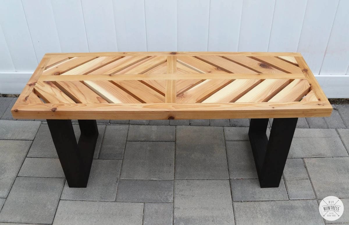 Outdoor bench with stained top and black painted legs