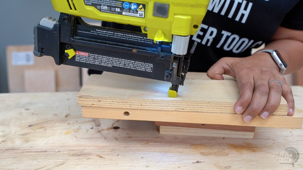 Using nail gun to attach boards