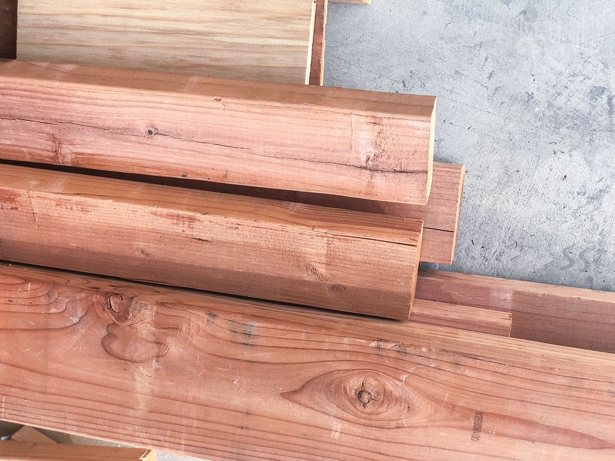 Pile of redwood on garage floor.