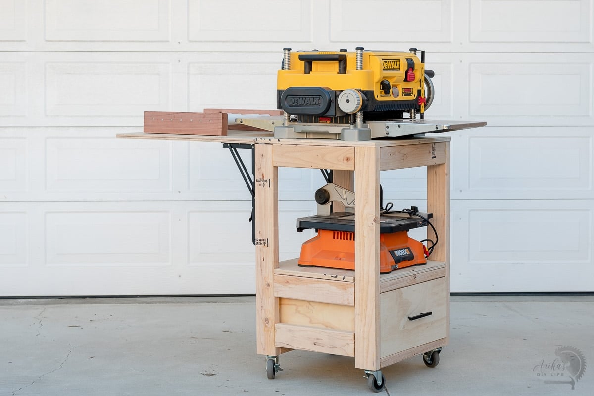 Planer stand with outfeed table open