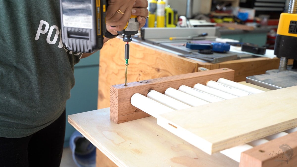 attaching the outfeed rollers to the outfeed table
