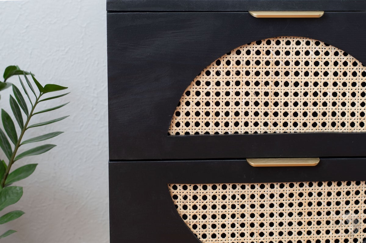 Close up of DIY nightstand with cane drawer fronts