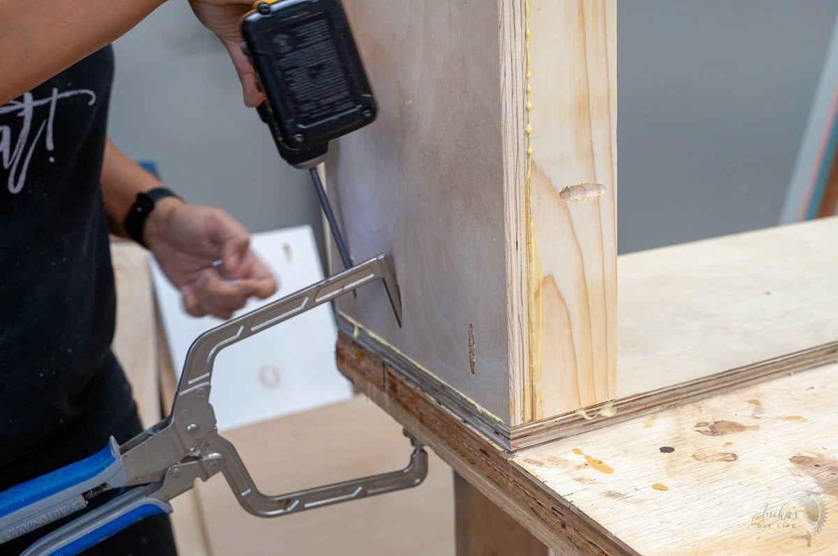 Attaching shelf and cleat to side of organizer
