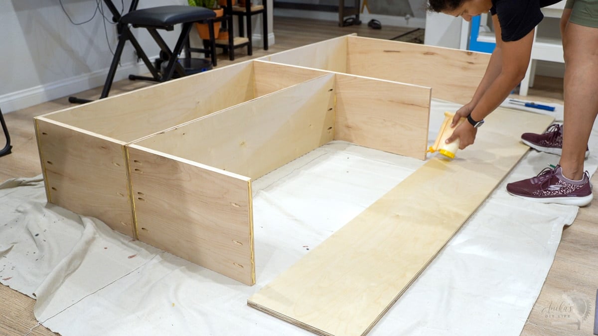 Woman attaching the closet organizer parts