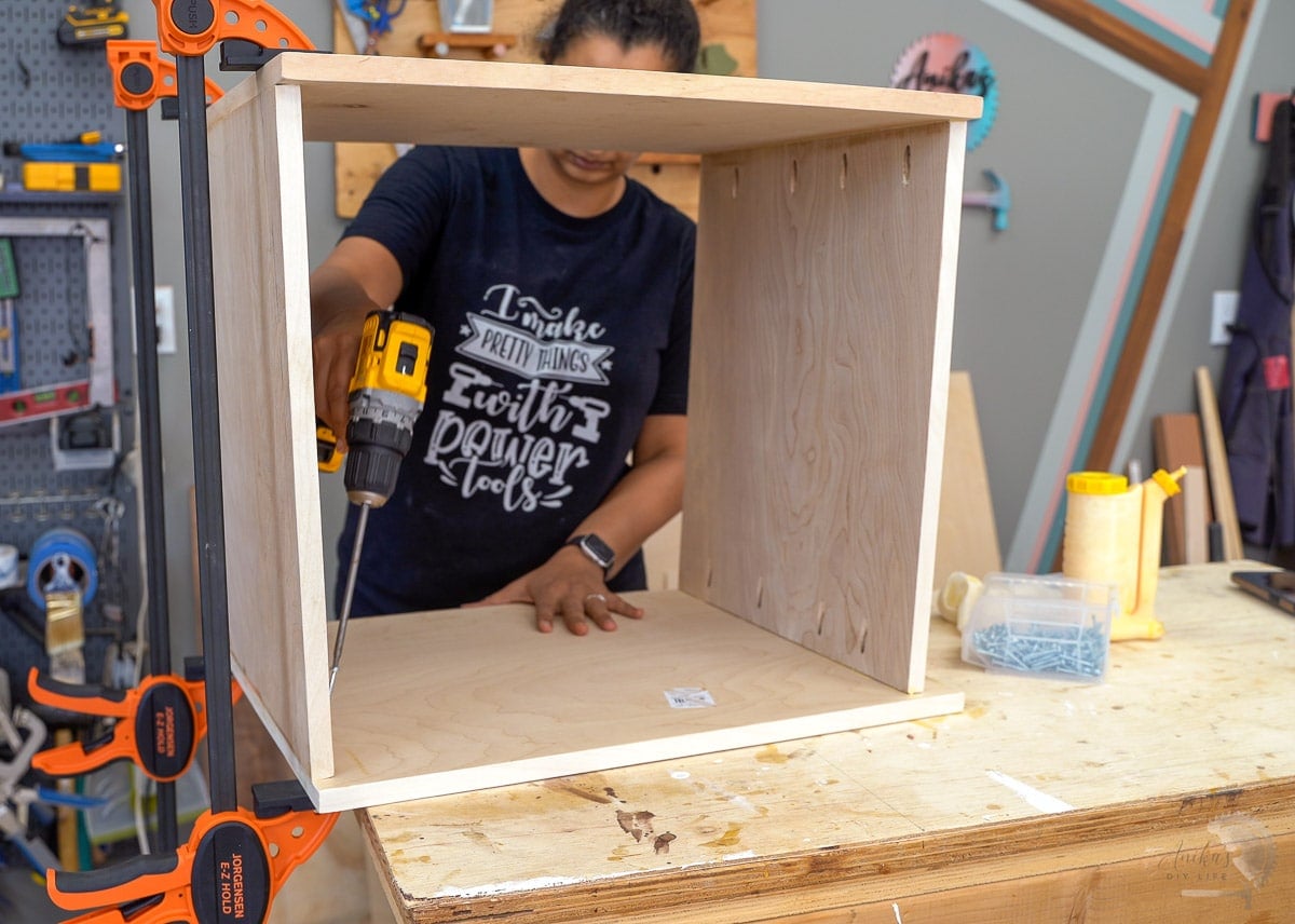 Woman building box using pocket hole screws