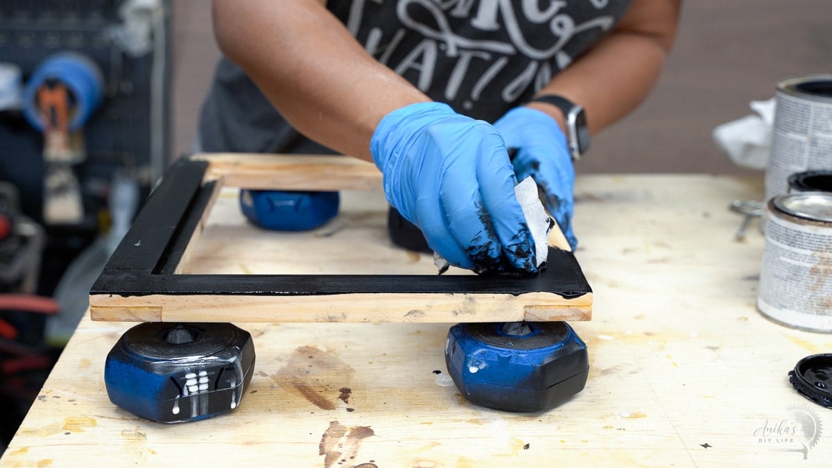 staining the frame in black stain