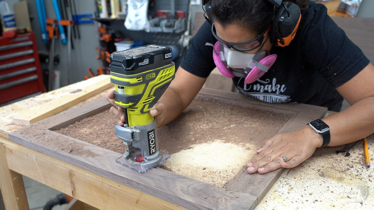 Woman making rabbet for door