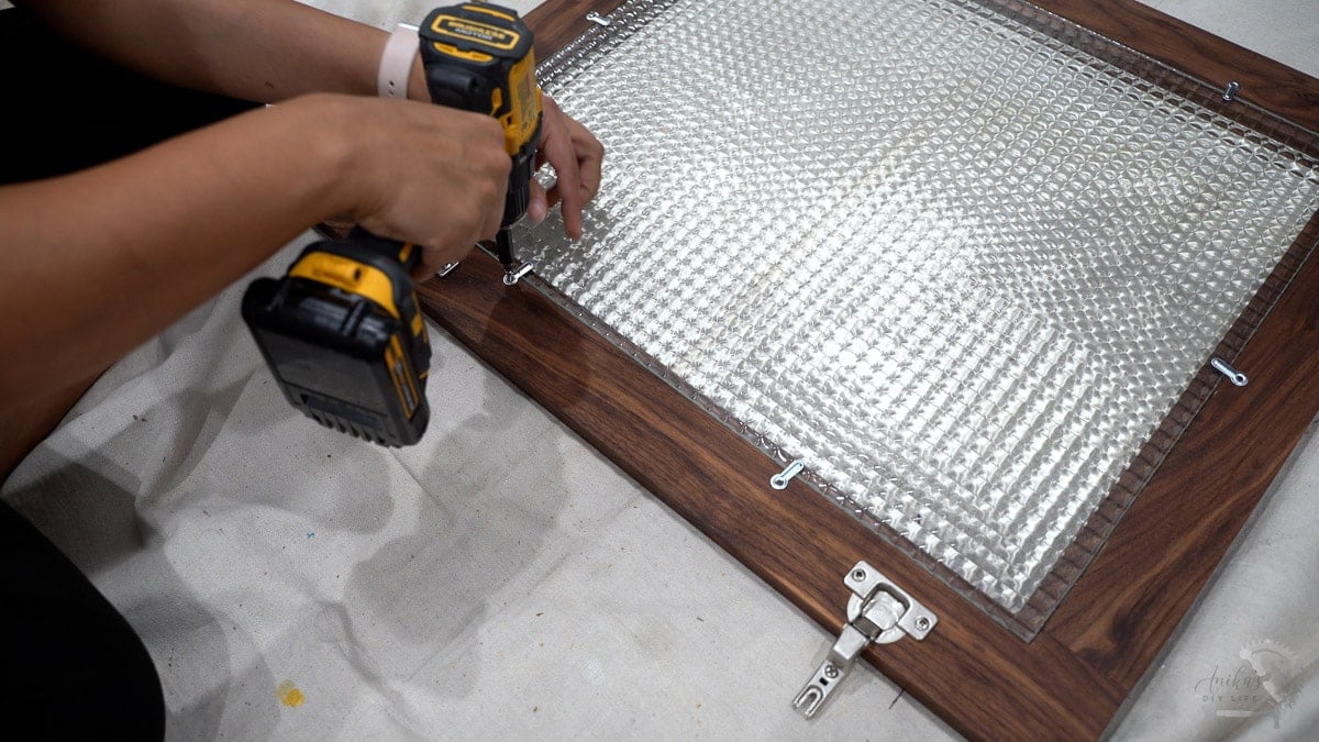 Adding clips to hold glass in place