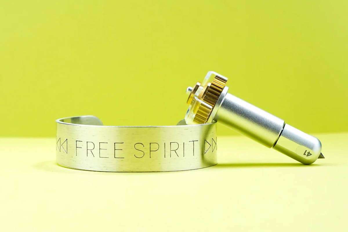Metal engrave bracelet pictured with the Cricut engraving tool