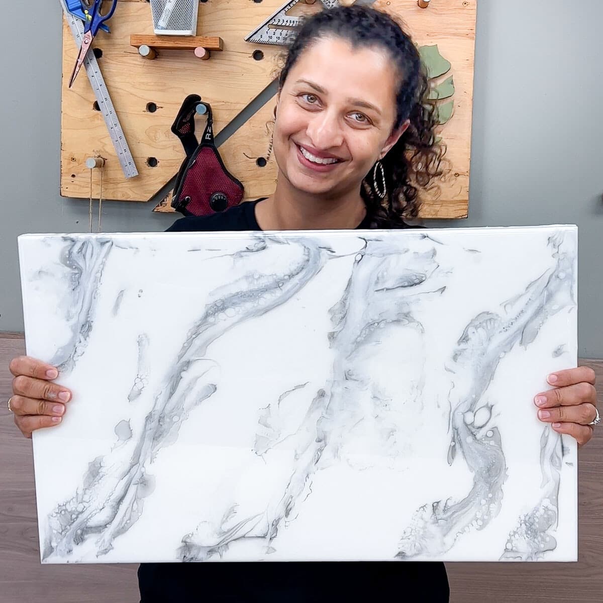 Anika holding epoxy marble counter