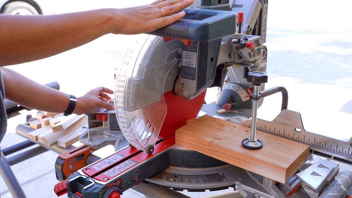 cutting scrap wood on miter saw.