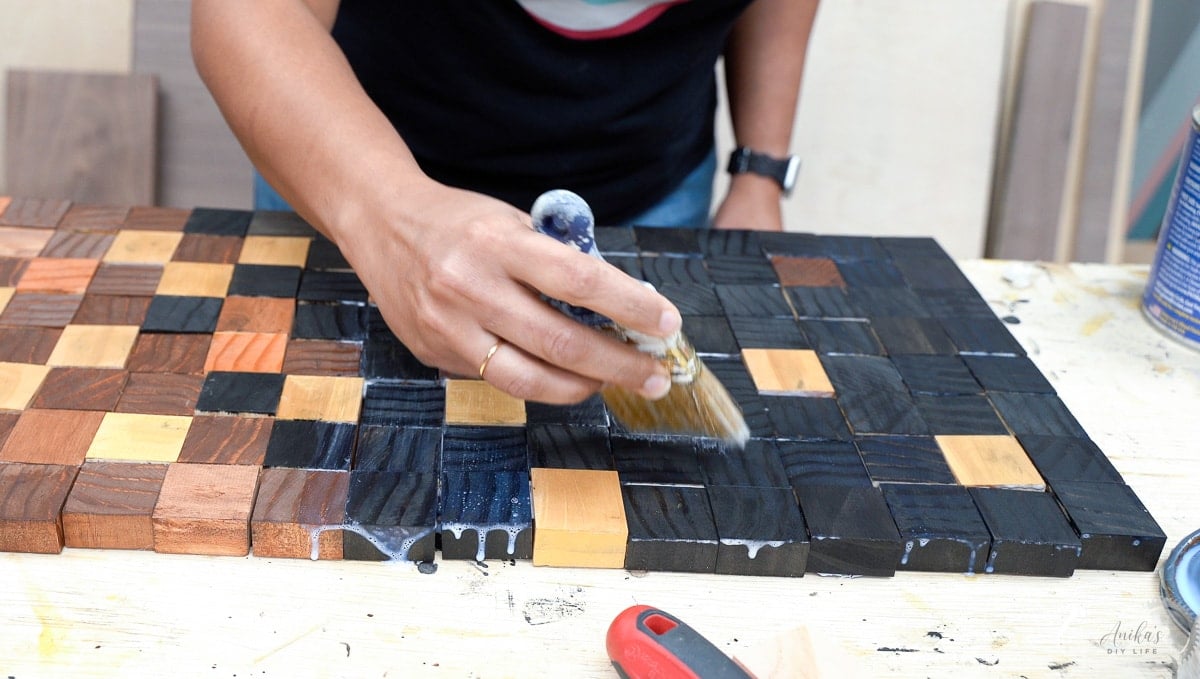woman applying top coat on table runner