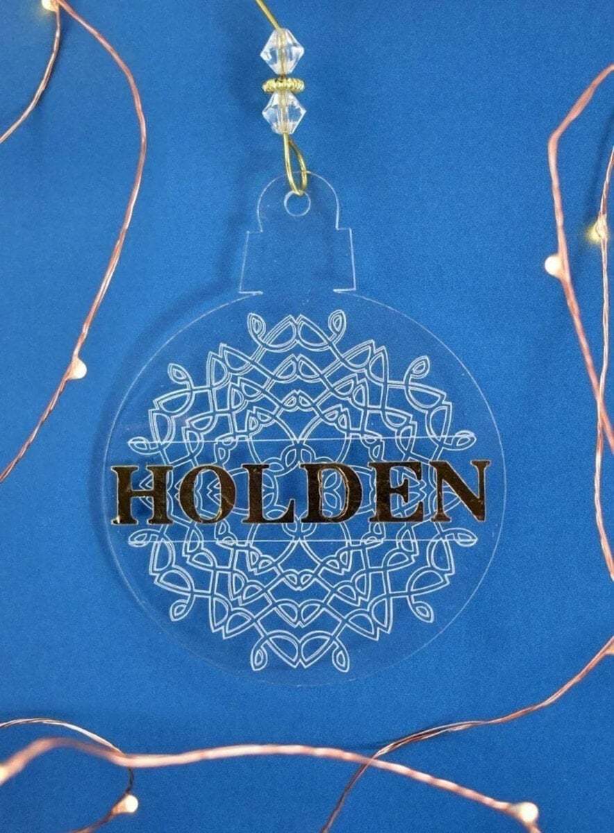 Engrave acrylic ornament with a snowflake and personalized with family name
