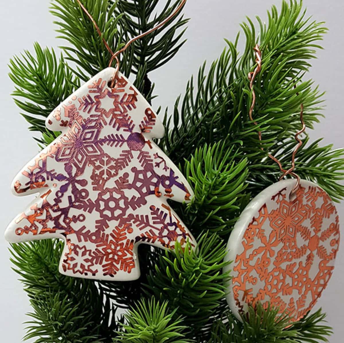 Ceramic ornaments with copper accents added using Cricut