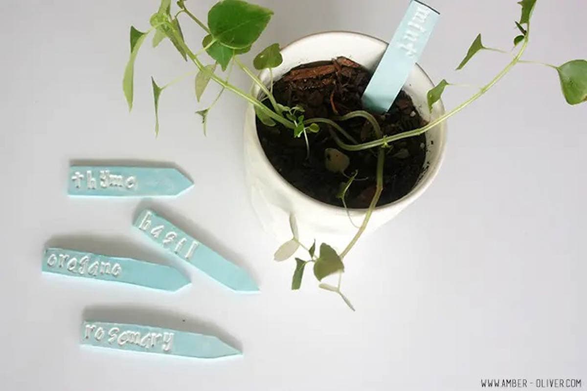 Plant markers made out of clay with herb name stamped into them