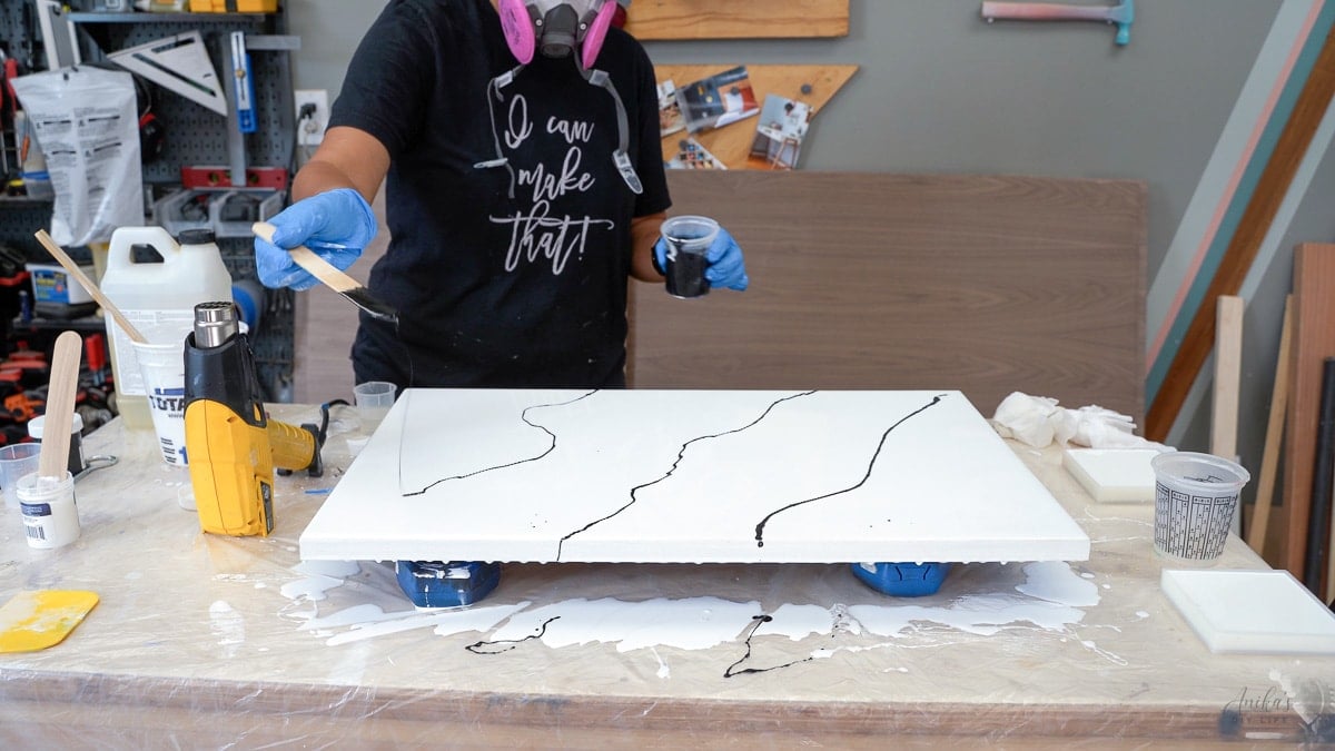 Adding black epoxy to create marble effect