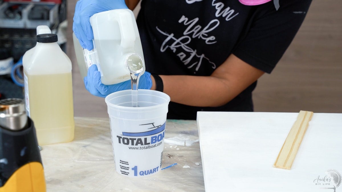 Pouring epoxy to mix into container for epoxy marble
