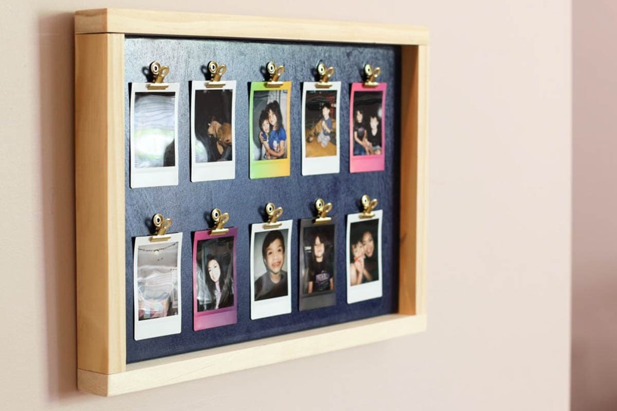 photo frame with mini photos clipped with magnetic clips