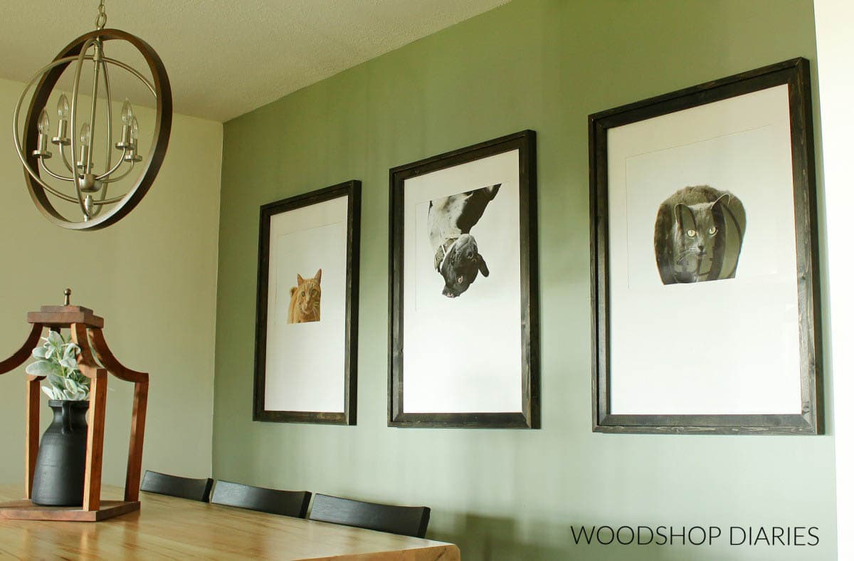 Three DIY picture frames hanging on the wall in the dining room