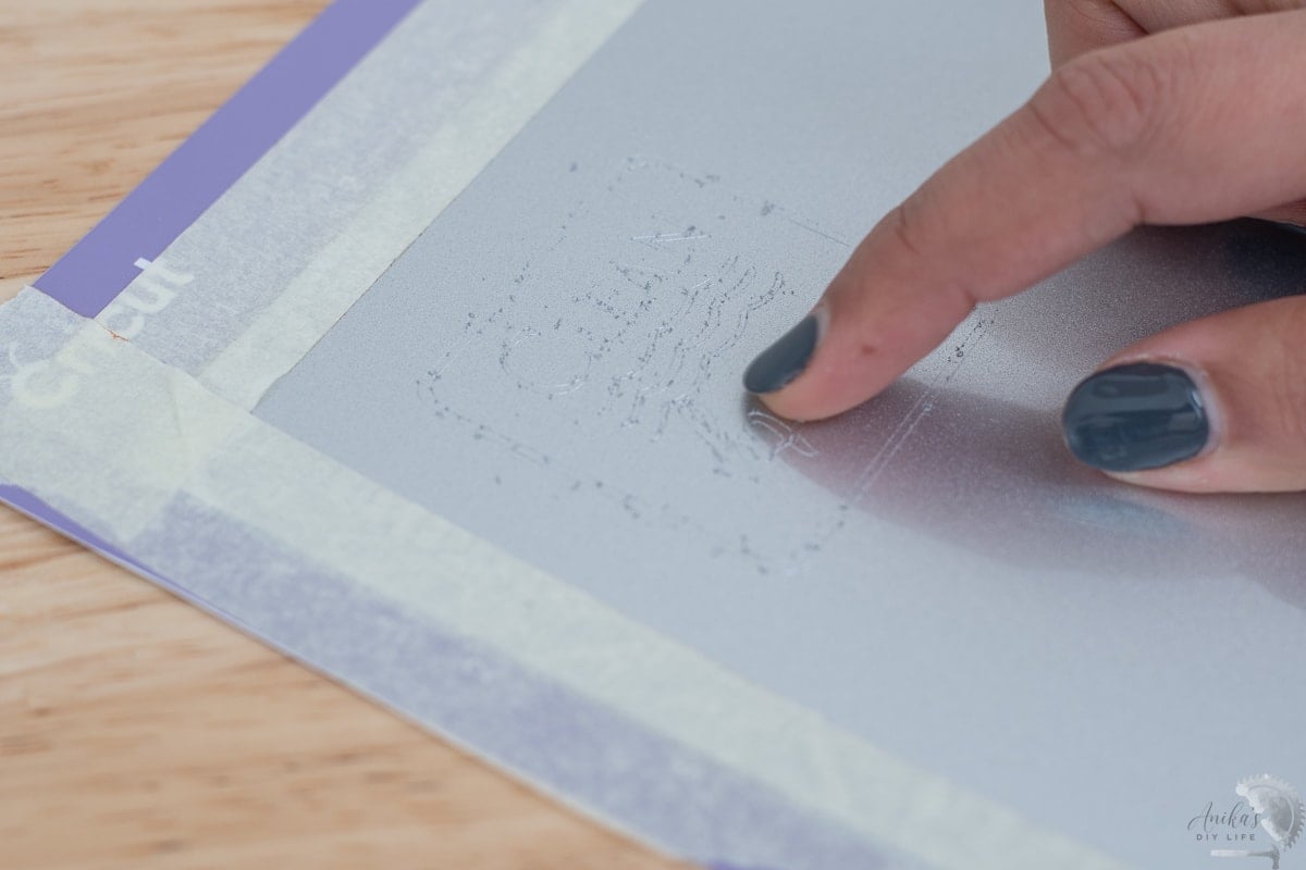 close up showing the engraving dust after engraving metal on the Cricut maker