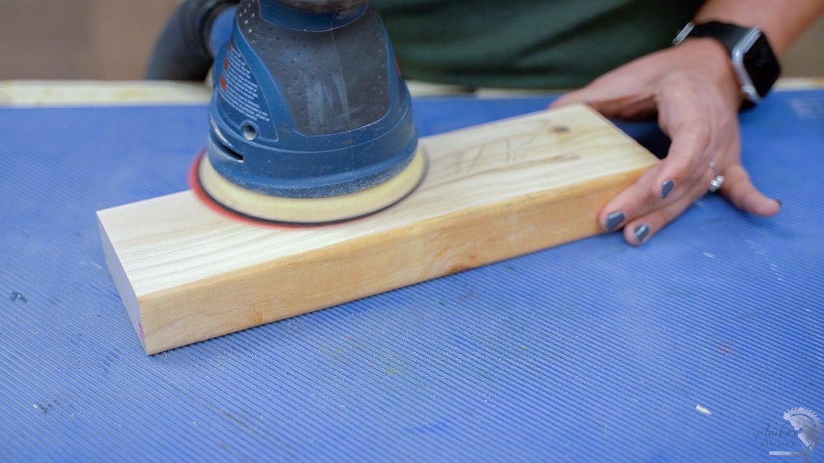 sanding boards to remove the pencil line