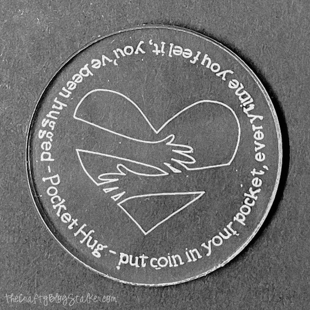 Acrylic engraved pocket hug coin