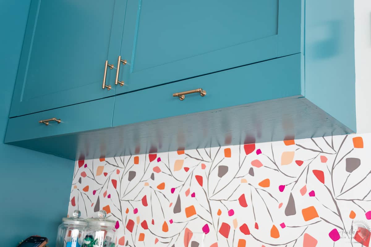 Showing bottom of the cabinet with longer sides for the pull out sweater drying rack