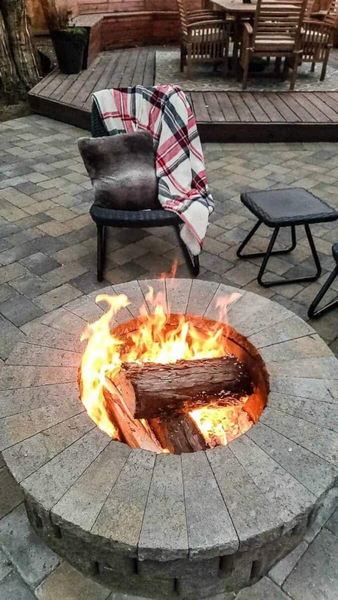 DIY fire pit idea using pavers on a stone patio