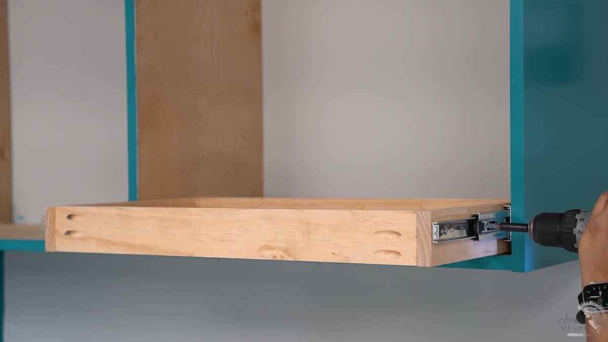 Attaching the pull out drying rack to the cabinet