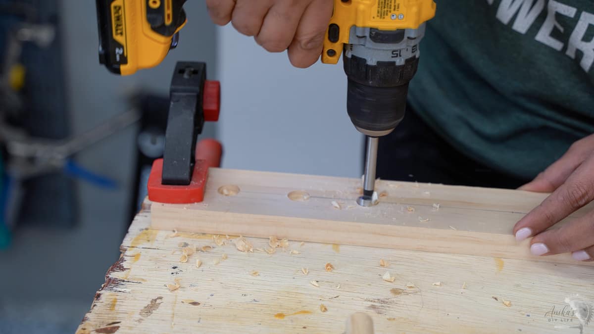 Making holes in a board with the Forstener bit for the pull out drying rack