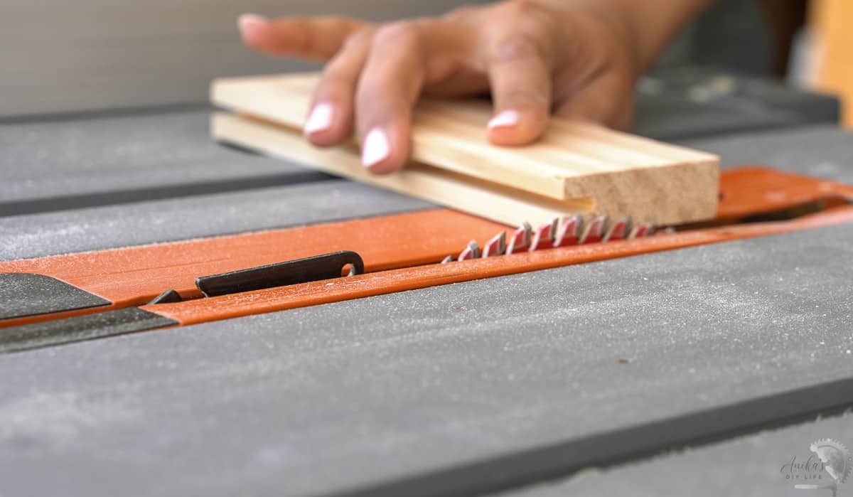 setting the height of the table saw blade to cut the tenons for shaker style doors.