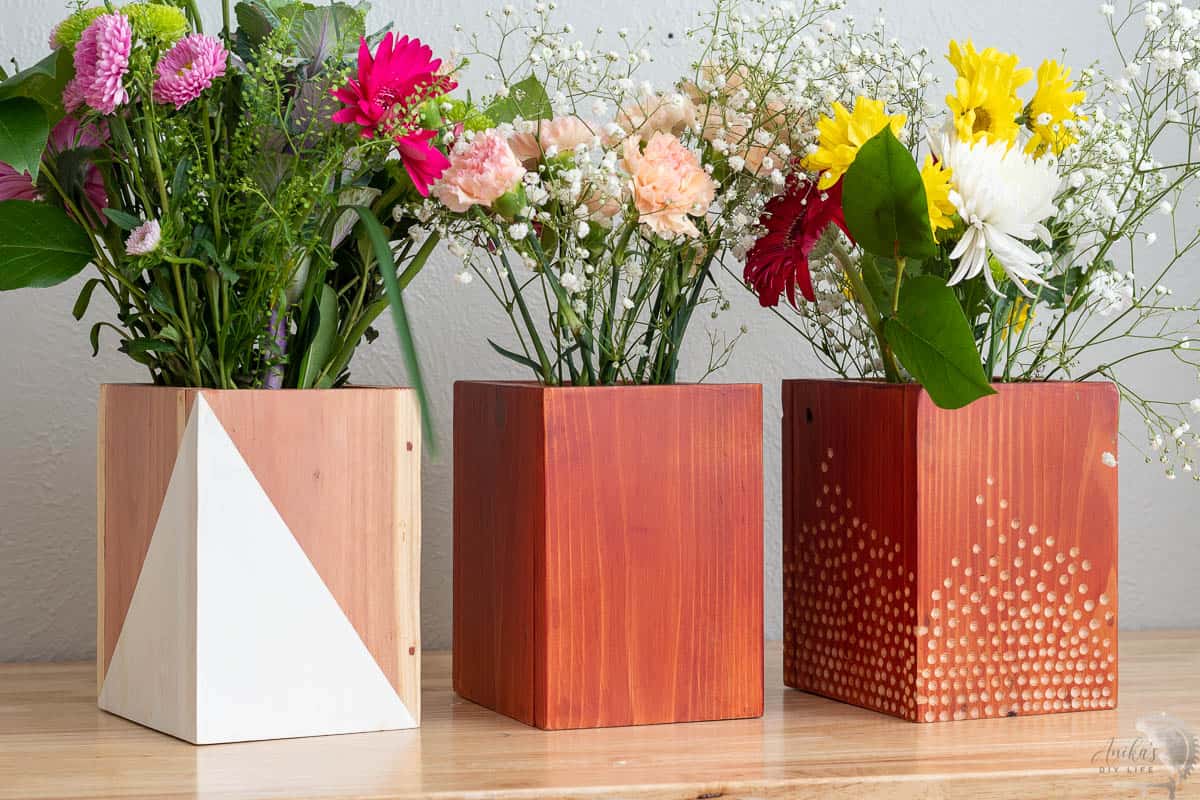 Redwood wood vases and planters with flowers