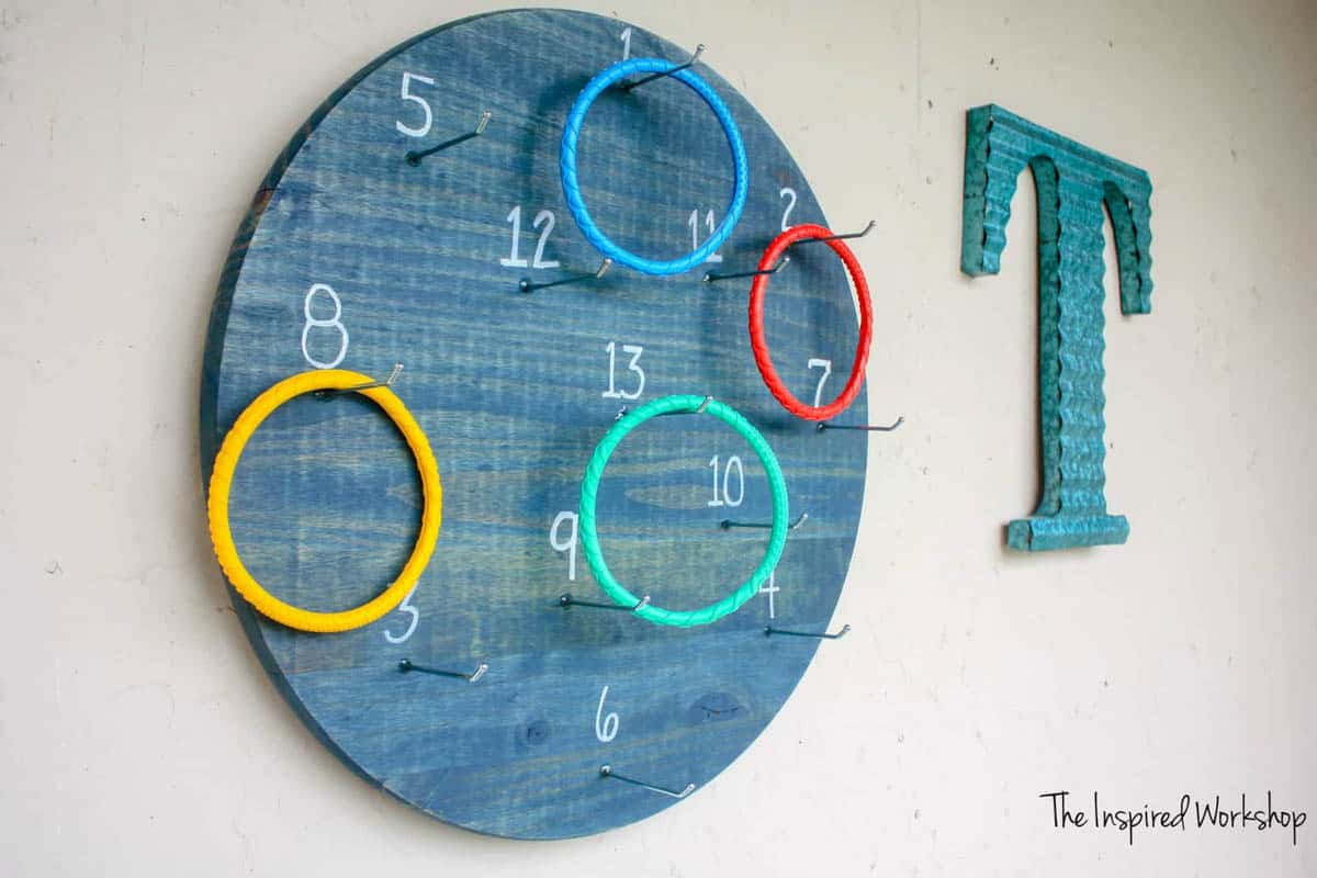DIY ring toss yard game that hangs on the exterior of your house