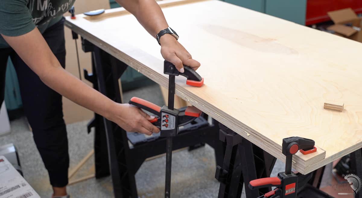 clamping strips of plywood to make the wooden countertop look thicker.